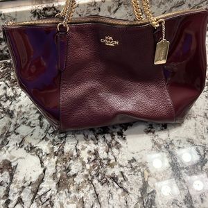Coach maroon leather handbag with gold accents, 16x10x5